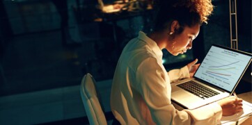 Woman sitting in front of a laptop